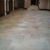 Three-Bay Garage Floor. Tiled using porcelain tiles in a modular pattern with expansion joints cut into floor.